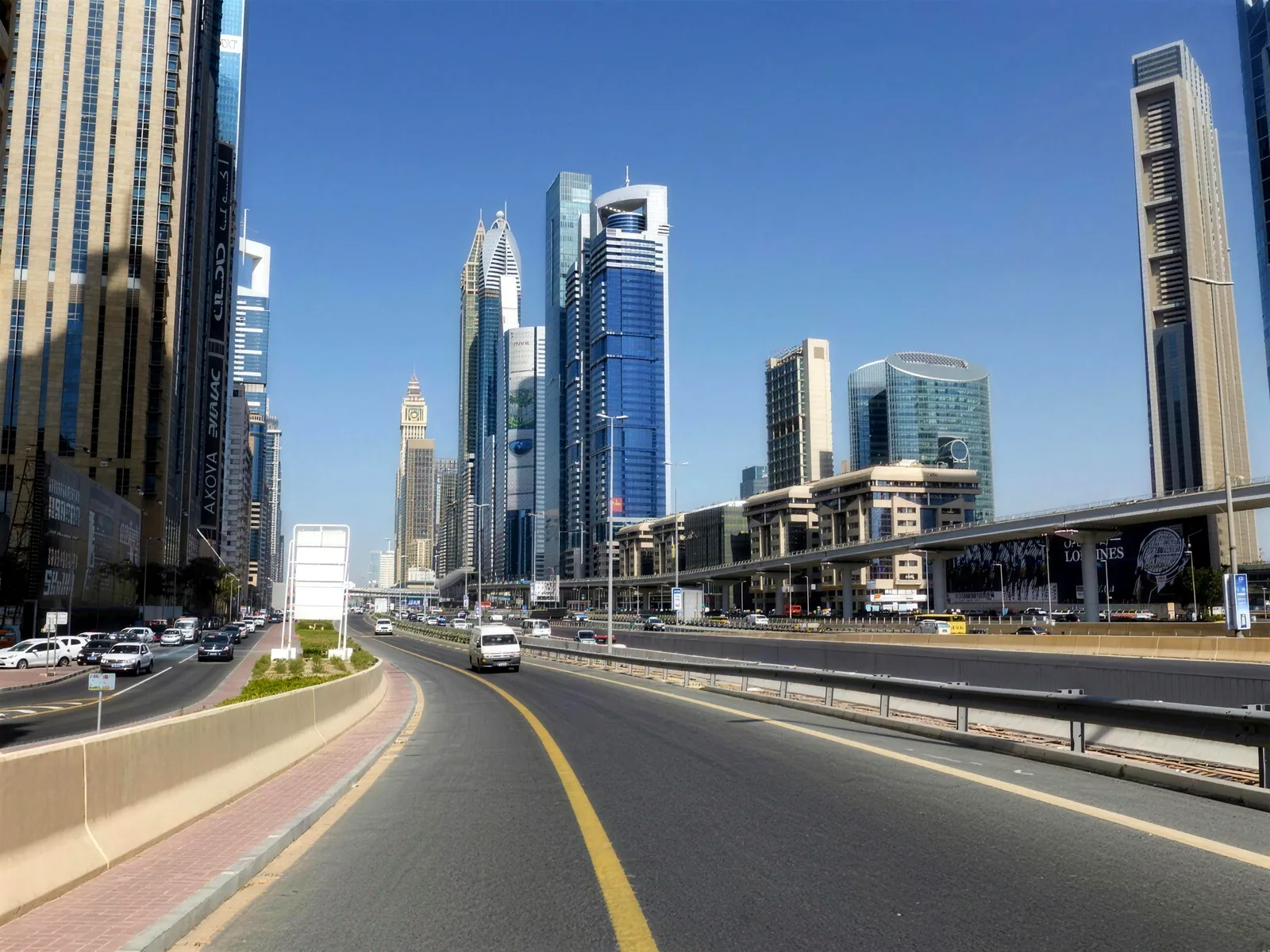 Sheikh Zayed Road in Dubai with an open lane in the foreground and the skyline behind